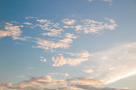 The clouds are exposed to the rays of a beautiful sunrise, Nature sky backgroundの写真素材
