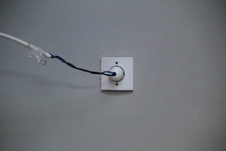 Sockets and cables standing on parquet floorsの写真素材