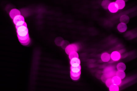 Blurred lights with purple bokeh effect Background