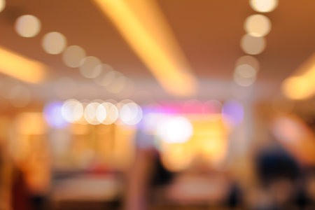 Soft warm golden light bokeh circles creating a beautiful abstract background texture effectの写真素材