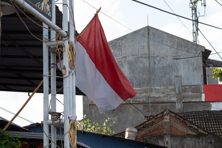 Urban Patriotism - Indonesian Flag Amidst Tangled Wiresの写真素材