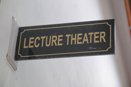 Lecture Theater Sign Mounted on a White Wall Indoorsの写真素材