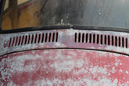 Close Up of Peeling Paint and Dust on a Vintage Car Detailの写真素材