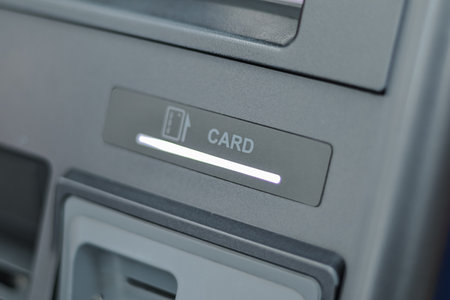 ATM Card Slot Illuminating with Natural Light, Providing Copy Space for Financial Service...