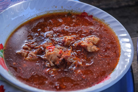 Authentic Lombok 'Begawe' Dish: Spicy Meat Simmered in Coconut Milk and Traditional Spices,...