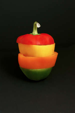 Stack of sweet sliced peppers of various colourの写真素材
