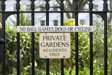 Private Gardens Sign outlawing ball games, dogs and cycles.の写真素材