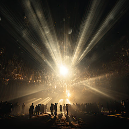 Silhouette of a crowd of people in front of a light beamの素材