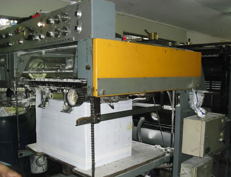 machines on a large printing plant factory, printing of books bad working conditions in asia sweat...