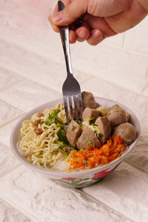 Delicious beef meatball soup tasty and healthy soup cooking also known as Bakso in Indonesia with...