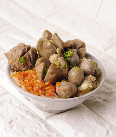 Delicious beef meatball soup tasty and healthy soup cooking also known as Bakso in Indonesia with fresh chili pasteの写真素材