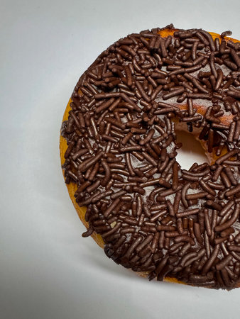 Delicious doughnut, sweet chocolate donut on white background freshly mad donut, in bakery