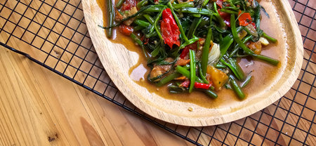 vegetable stir fried water spinach on chinese style cooking served on plate, sauteed water spinach one of the typical foods of Asian origin, good for cooking recipes ideasの写真素材