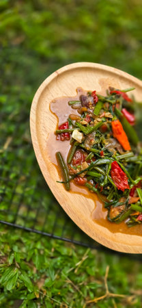 vegetable stir fried water spinach on chinese style cooking served on plate, sauteed water spinach one of the typical foods of Asian origin, good for cooking recipes ideasの写真素材