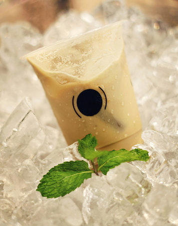 Delicious and refreshing coffee based beverage, ice coffee, cold drink, coffee beans in the cafe