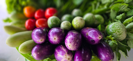assortment of fresh organic vegetables and fruits in colorful arrangement , good for cooking multimedia creative content creation and recipe bookの写真素材