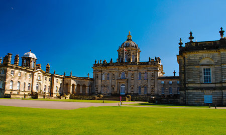 beautiful and enchanting old and ancient building in rural europe left untouched in green landscape and blue sky, medieval castle landscape good for multimedia content creationの写真素材