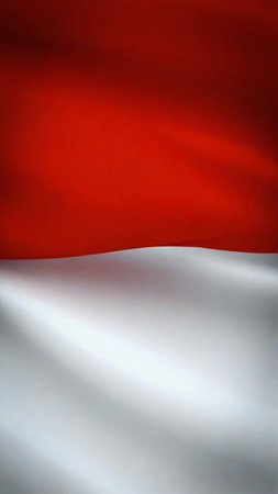 Indonesian flag waving the red and white flag represents symbol of courage and purity, picture the flag of Indonesia with its red symbolizing courage and bravery, and white symbolizing purity and peace good for multimedia content creationの写真素材