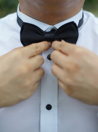 Professional man, fine gentleman, business executive fitting to their suit and preparing for daily office job, dressing to gentleman suit good for executive magazine or multimedia content creationの写真素材