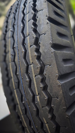 detailed image of a car tire showcasing its intricate tread pattern for enhanced grip and...
