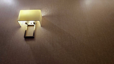 interior lamp with a minimalist design, softly illuminating the surrounding area in a modern room, Modern Lamp with Soft Light in Interior Settingの写真素材