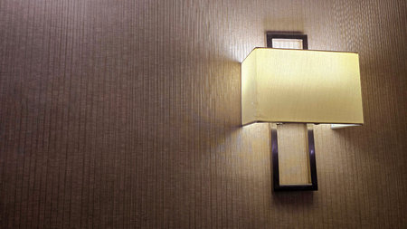 interior lamp with a minimalist design, softly illuminating the surrounding area in a modern room, Modern Lamp with Soft Light in Interior Settingの写真素材