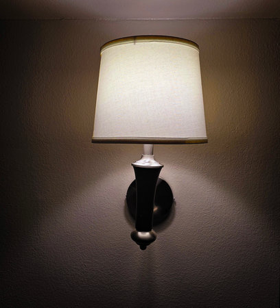 interior lamp with a minimalist design, softly illuminating the surrounding area in a modern room,...