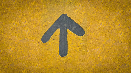 rustic Bold gray up arrow on a rough yellow wall conveys direction, guidance, and forward movement....