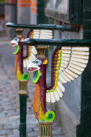 Railings on entrance steps with painted griffinsの写真素材