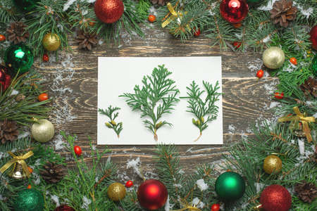 Christmas background with decorations and gift boxes on wooden board