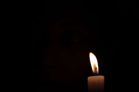 Candle Flame On A Black Background Photo Shot.の写真素材