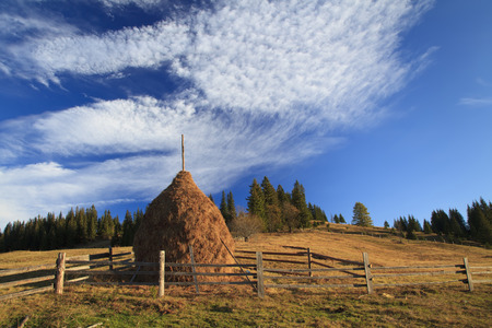 Haystack on a background of blue skyの写真素材