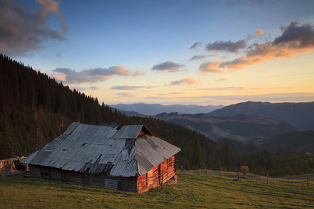 Old house in the mountains at dawn の写真素材