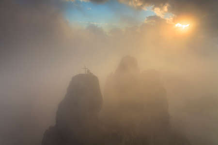 Rocks at sunrise in dramatic cloudsの写真素材