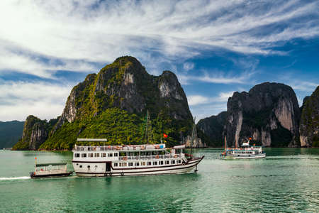 View of ships and islands in Halong Bay at sunset, Vietnam.の写真素材