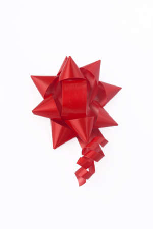 red ribbon for packing gifts isolate on a white backgroundの写真素材
