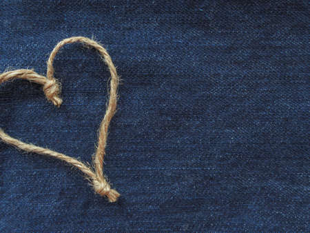 Sign heart of twine in denimの写真素材