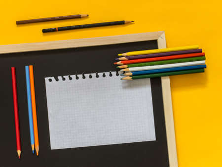 Flat lay art accessories on yellow background with blank space for text. Top view. Copy space.の写真素材