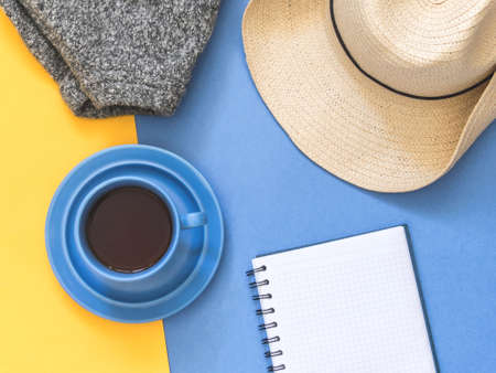 Top view goals list with notebook, cup of coffee on blue background. Flat lay, copy spaceの写真素材