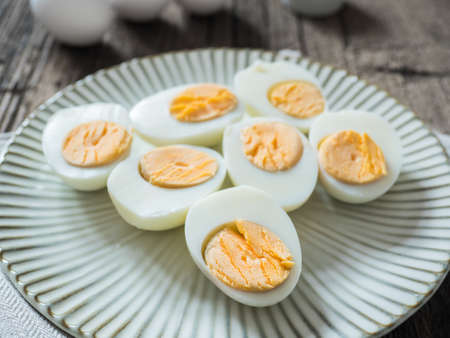 Boiled chicken eggs on a gray plate.