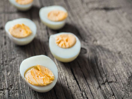 Boiled chicken eggs on wooden background.の写真素材