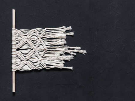 Macrame.  White thread, black background, closeupの写真素材