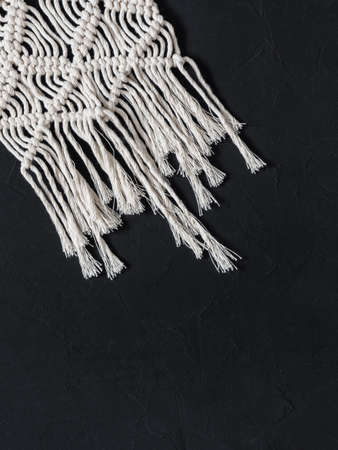 Macrame.  White thread, black background, closeupの写真素材