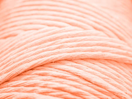 Cotton cord for macrame. Skein closeup. Ð¡oral background