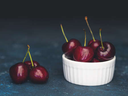 Healthy berry. Fresh group large cherries on a dark background. Closeup