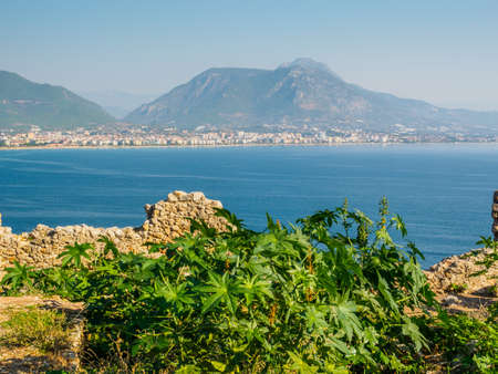 Alanya, Turkey. Beautiful view from the fortress Alanya Castle of the Mediterranean Sea and beach at sunset. Vacation postcard backgroundの写真素材
