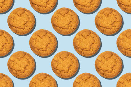 Healthy oatmeal cookies seamless trend pattern isolated on blue background. Top view