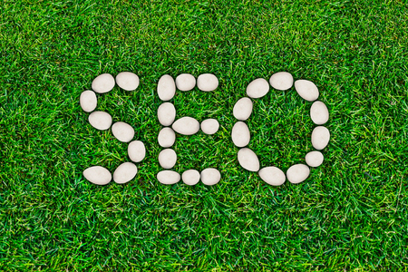 SEO, search engine optimization. Website traffic promotion. Internet technologies. The word laid out on the lawnの写真素材