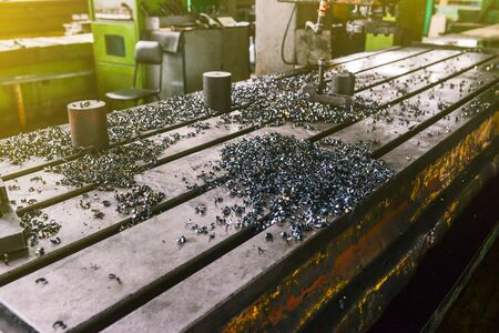 Metal shavings on the machine. The metalworking process at the factory. Industrial production of partsの写真素材