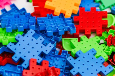 Plastic toy blocks, designer of children's toys. Bright building blocks. Child development in children's centers.の写真素材